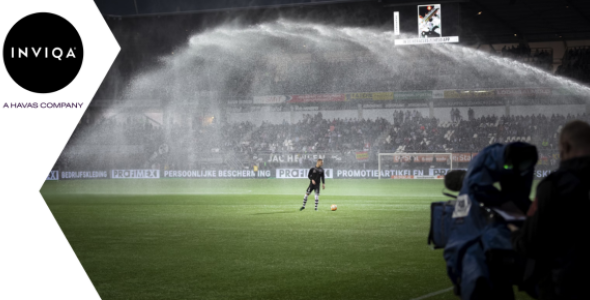 Image of a footballer on a football pitch | Inviqa Blog