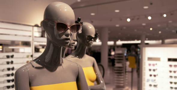 Two female mannequins modelling sunglasses. Or are they robots shopping for shades?