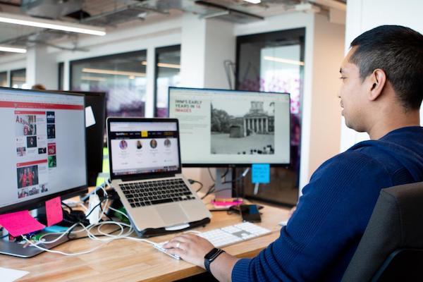 Man working on IWM website