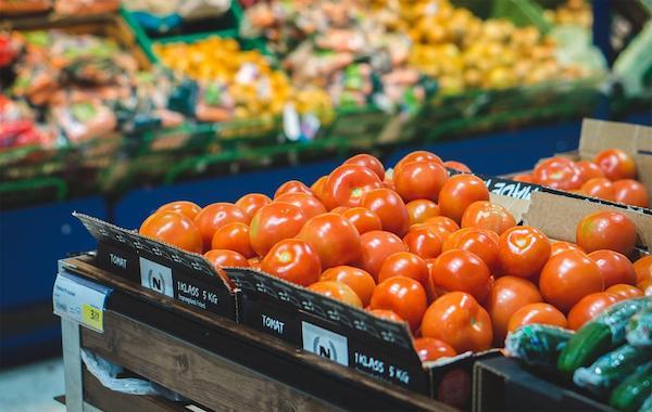 Tomatoes in a crate in a shop