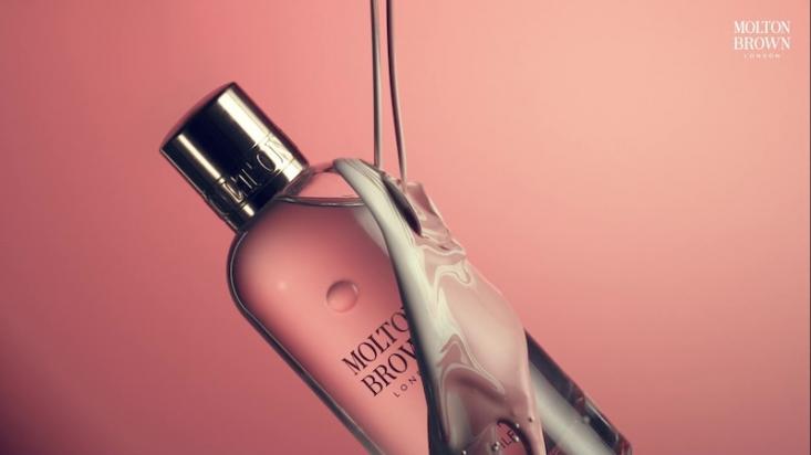 Molton Brown body wash on pink background